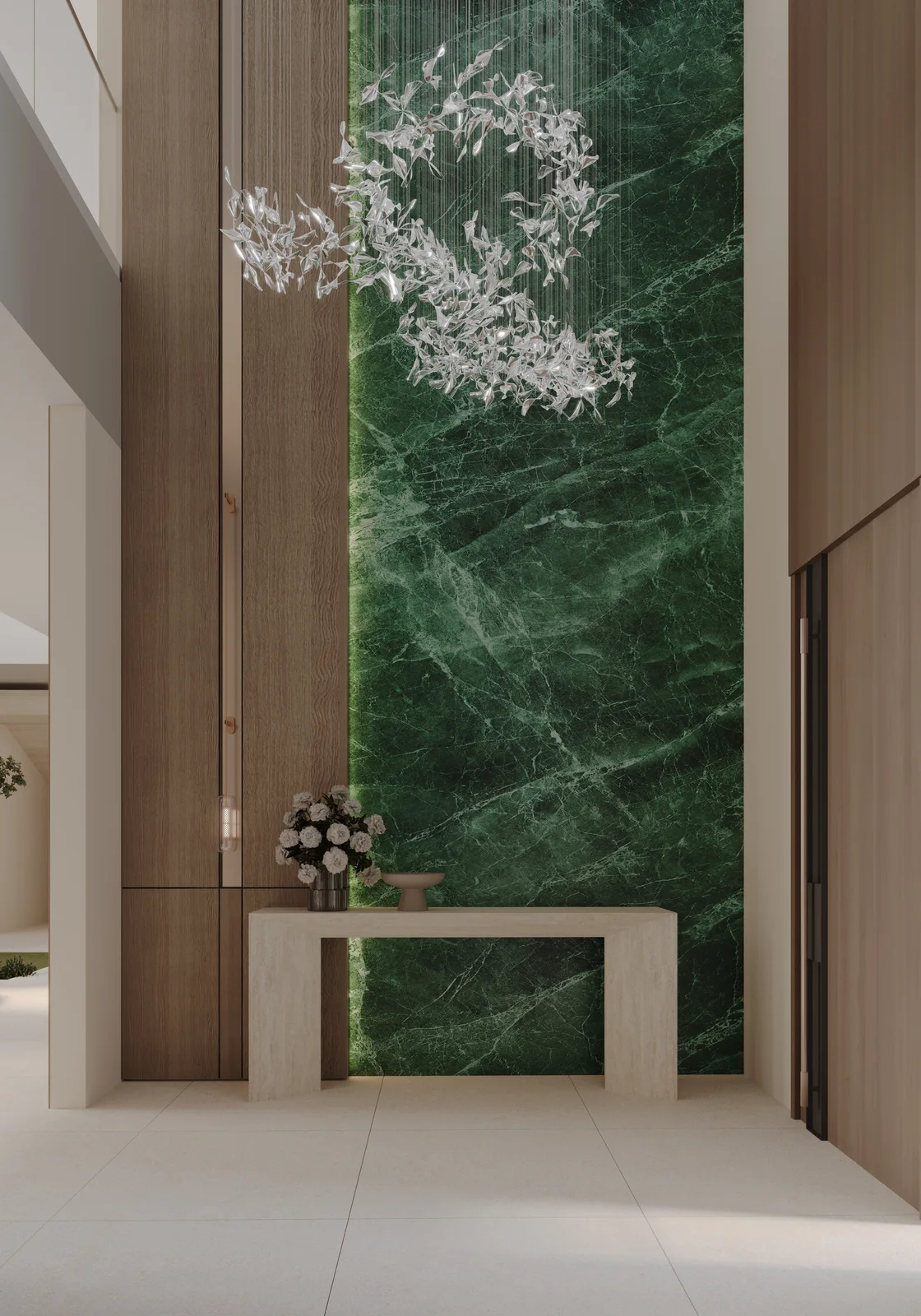 Modern luxury entrance foyer with green marble feature wall and glass leaf chandelier UAE